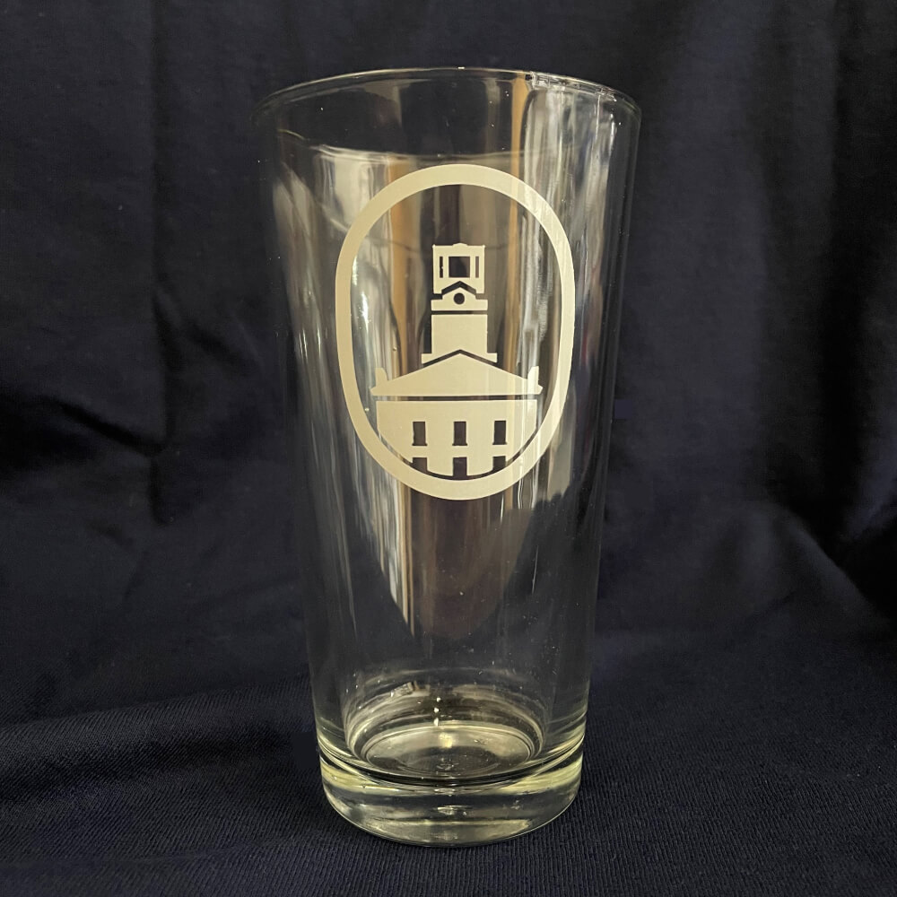 A 16oz clear pint class. Erwin Tower is screen printed on the front of the glass in white.